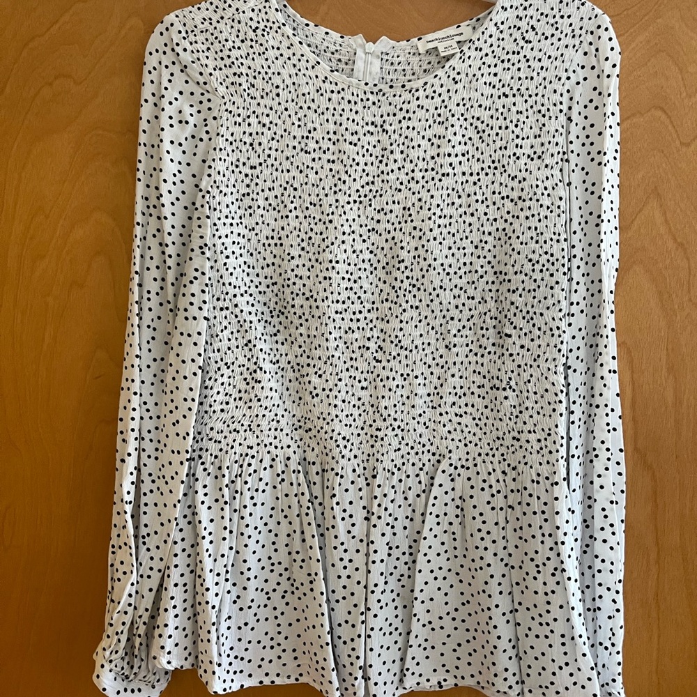 Polka dot blouse with stretch top and lightly flared bottom. Lightly worn.